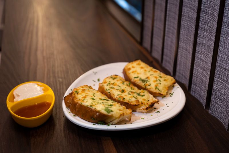 Garlic Bread with marinara dipping sauce at Pizza luce